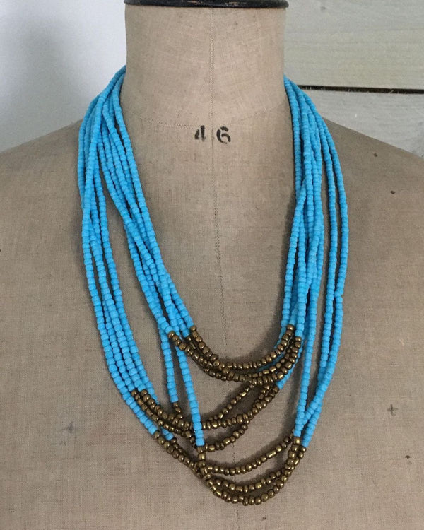 Light Blue Opaque Glass Bead Necklace with Bronze Accent | Tribal