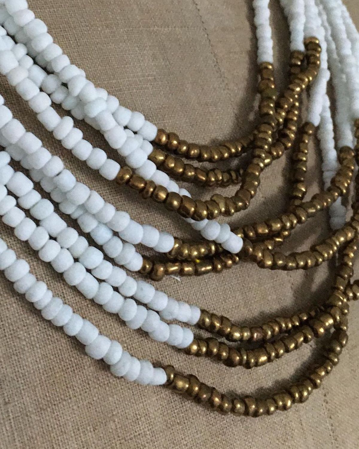 White Opaque Glass Bead Necklace with Bronze Accent